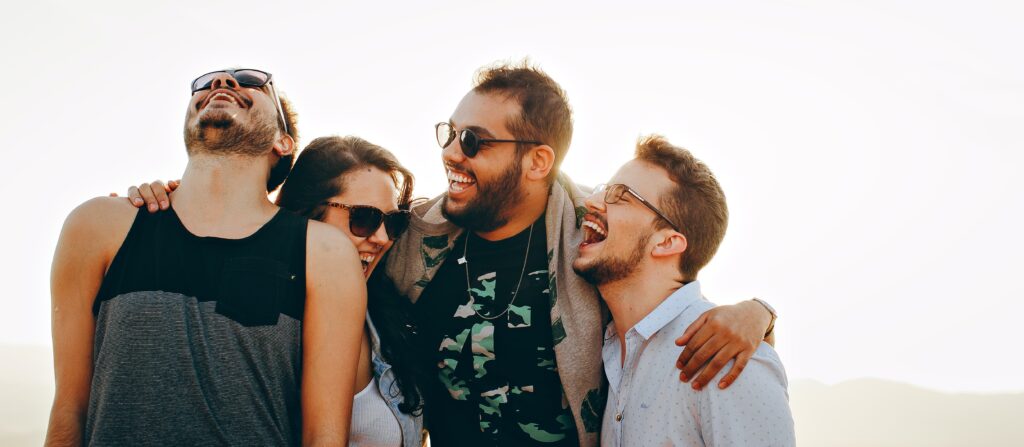 A group of people laughing representing life after recovery at Gratitude Lodge.