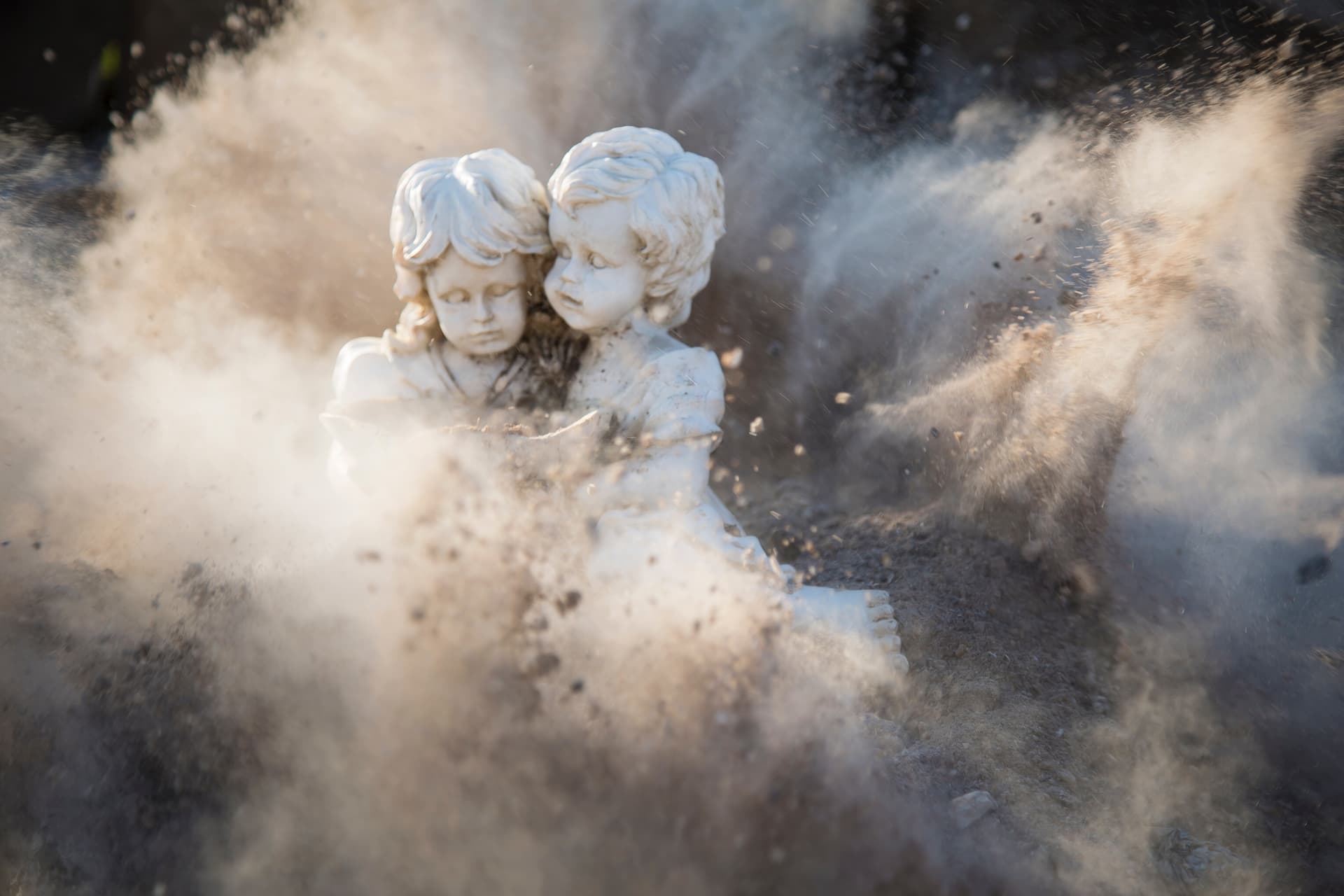 An image of a statue of children being destroyed, symbolizing the damage of cocaine abuse