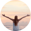A woman celebrating sobriety at the beach