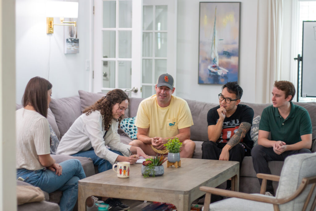 group of 5 people sitting on a couch representing Qualifying for inpatient rehab