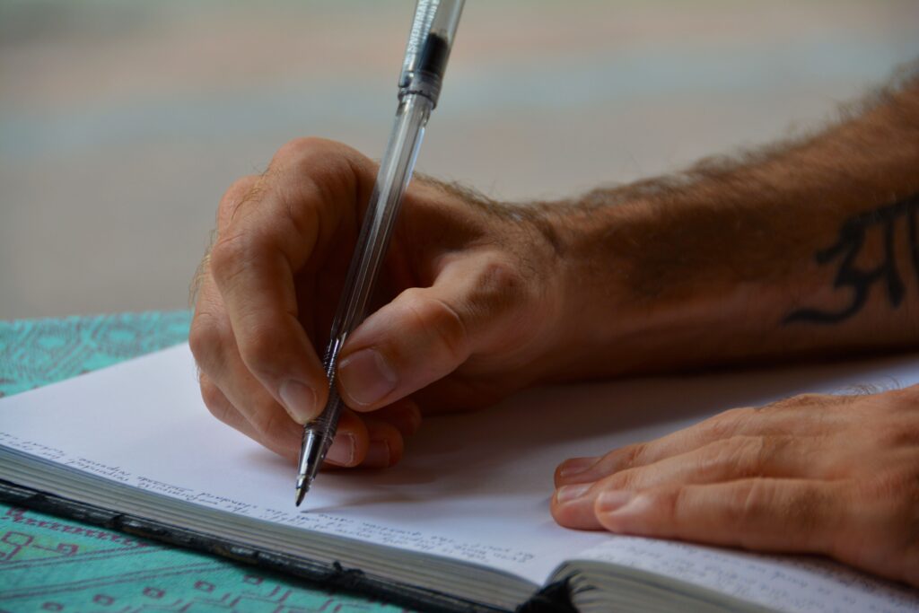 an image of someone writing a relapse prevention plan