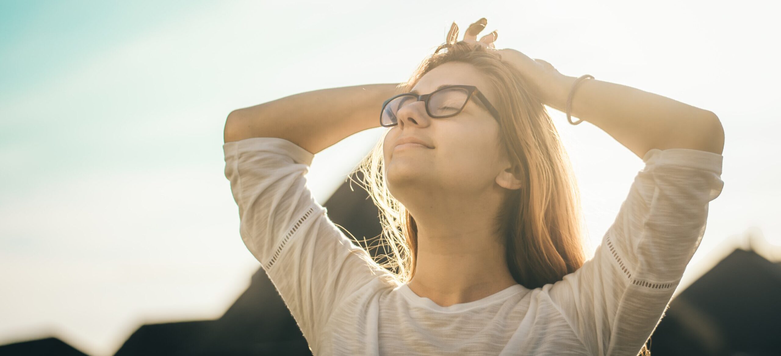 A woman smiling representing life after rehab.