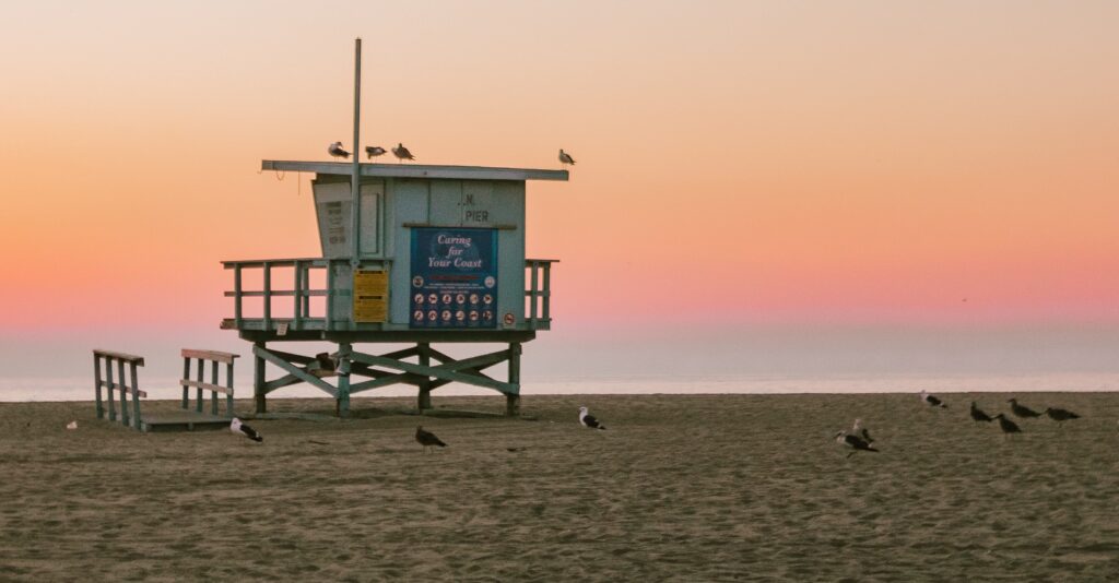 A lifeguard post on laguna beach at sunset representing long beach opioids.