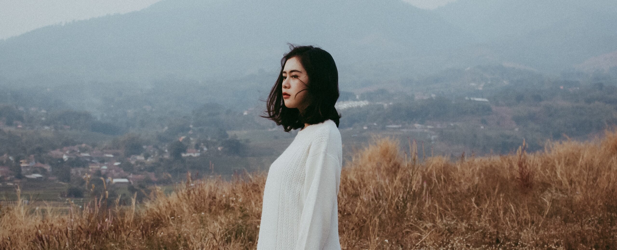 woman looks out at a field representing tapering off lexapro