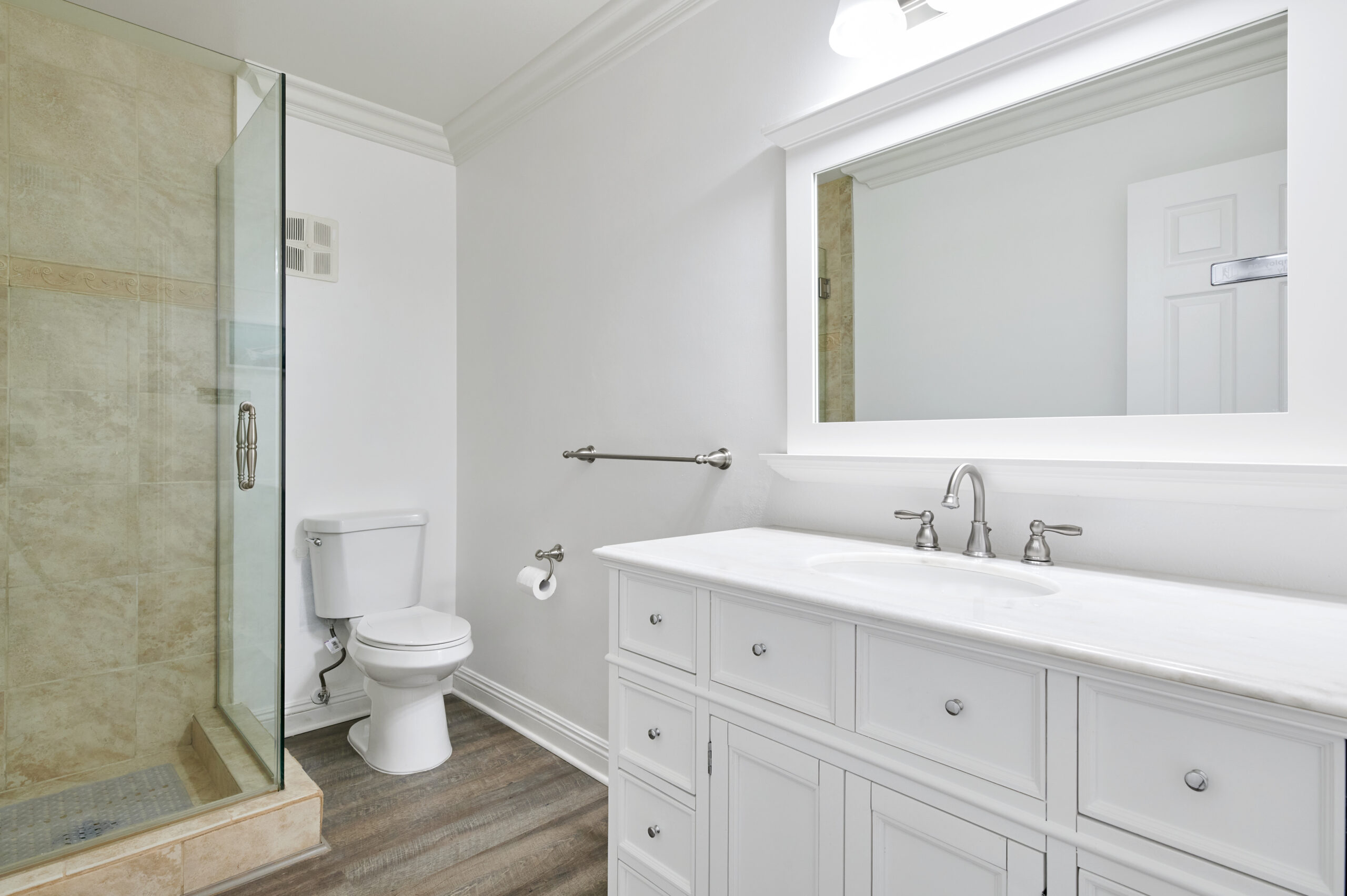 image of the bathroom at Gratitude Lodge rehab facility with a shower, sink, and toilet