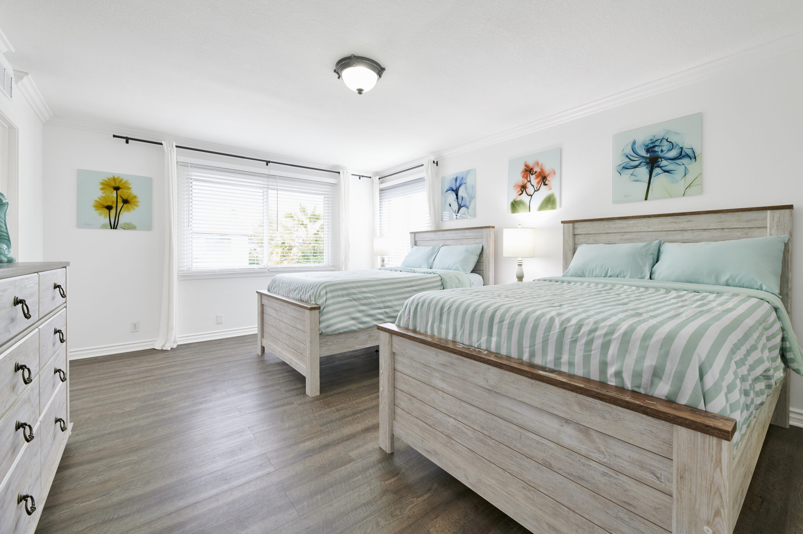 image of a bedroom with 2 beds in Gratitude Lodge rehab facility