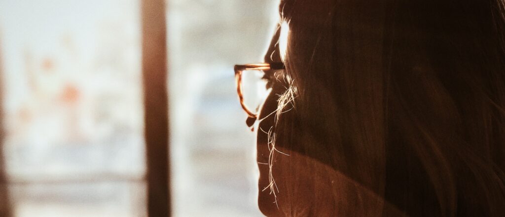 woman looks out window representingwhat is the whippet drug