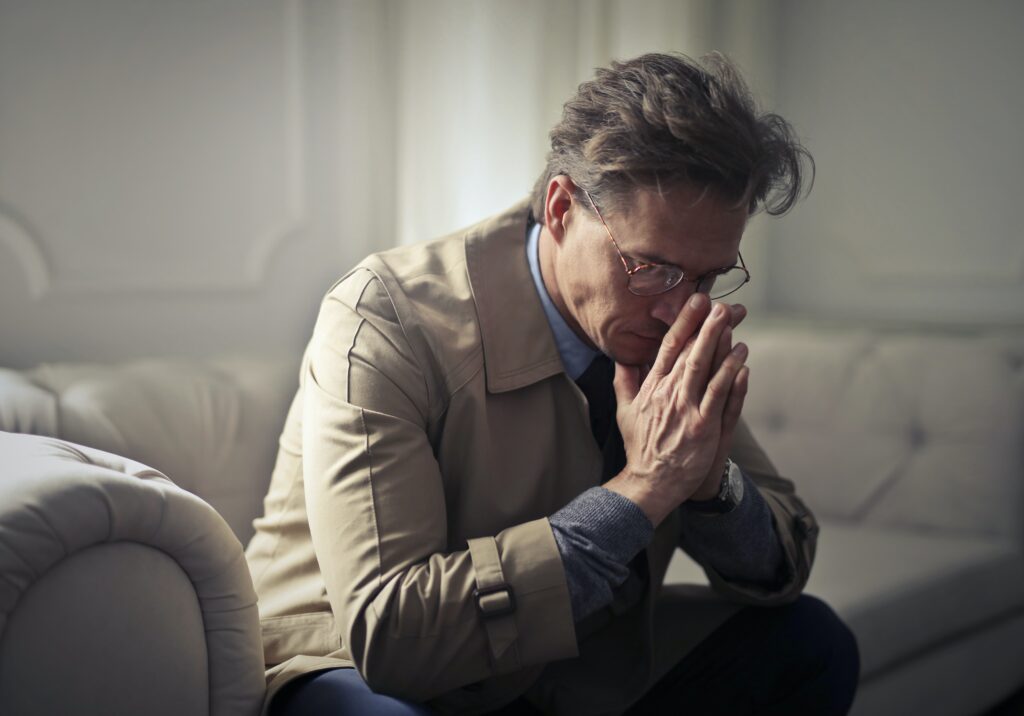 An image of a man who is experiencing the adverse effects of mixing Wellbutrin with alcohol