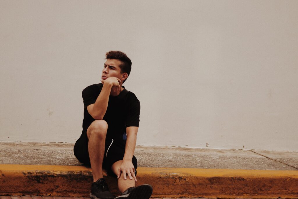A man stares into the distance after learning about alcoholism nose