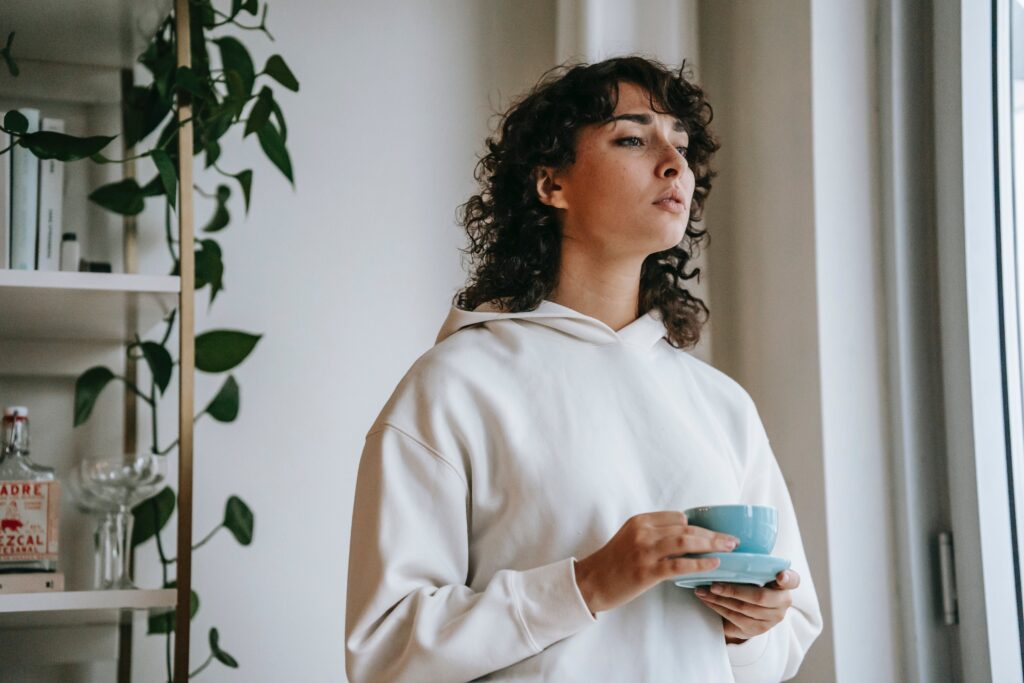 A woman drinks coffee after she learned about the dangers of mixing Tylenol with alcohol