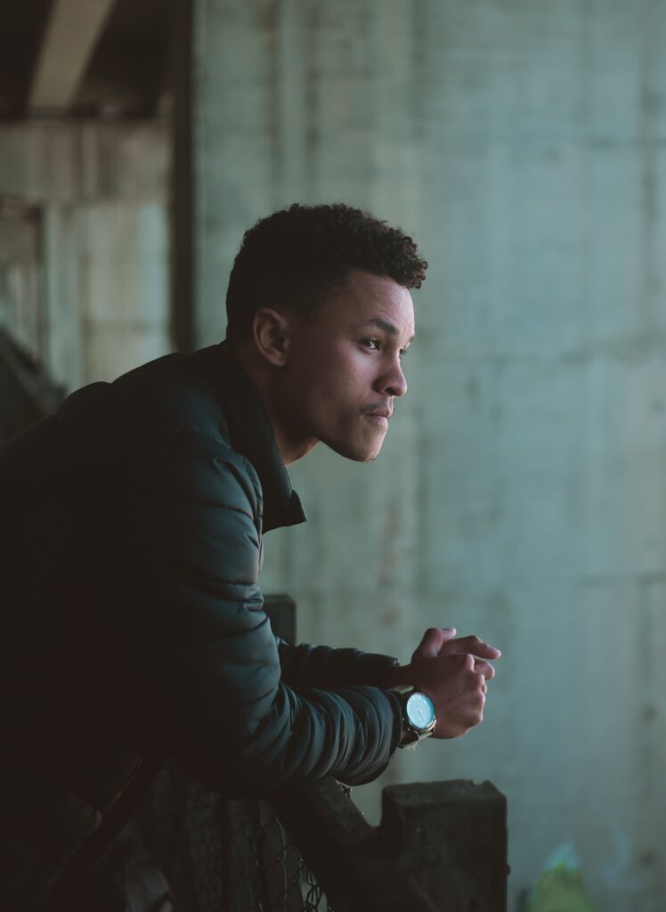 A man sitting in deep thought about Benzodiazepine toxicity symptoms