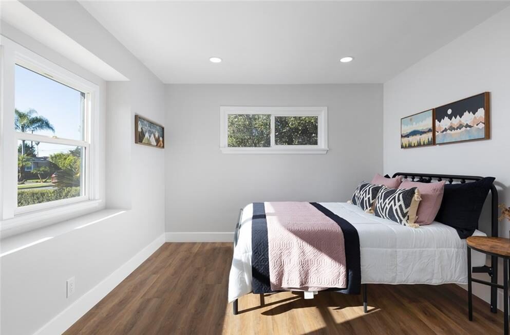 Single bed in a bedroom and facing the window out