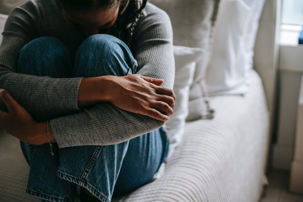 A woman appears distressed, depicting Symptoms of drug induced schizophrenia