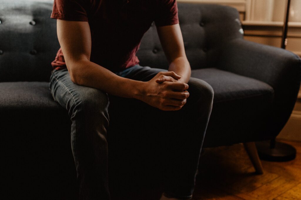 person sitting thinking representing how long does cocaine stay in your system