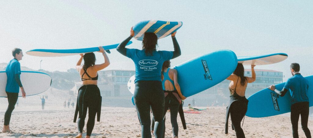 group of people surfing representing Alcohol treatment newport beach